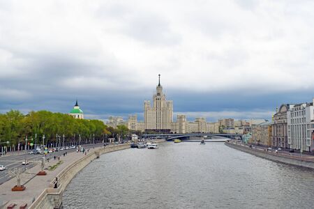 Moscow, Russia - may 2, 2019. View of the river, Kotelnicheskaya embankment and Stalin era tower building skyscraper. City center. Copy space.のeditorial素材