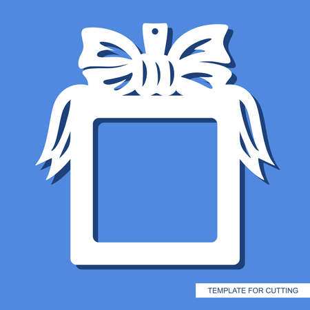 Square photo frame. Hanging decoration in the form of a gift with a bow and ribbons. Copy space.のイラスト素材