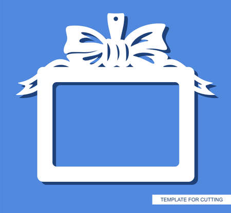 Rectangular horizontal photo frame. Hanging decoration in the form of a gift with a bow and ribbons. Copy space. Layout for plotter laser cutting of paper, cardboard, plywood, wood, metal, cnc. Vectorのイラスト素材