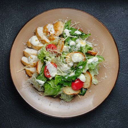Fresh Vegetable mix Salad on a wooden backgroundの写真素材