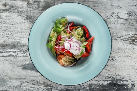 Fresh Vegetable mix Salad on a wooden backgroundの写真素材