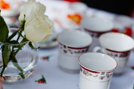 Composition with beautiful tea service on table on bright background.の写真素材
