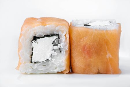 Fresh japanese sushi rolls on a white backgroundの写真素材