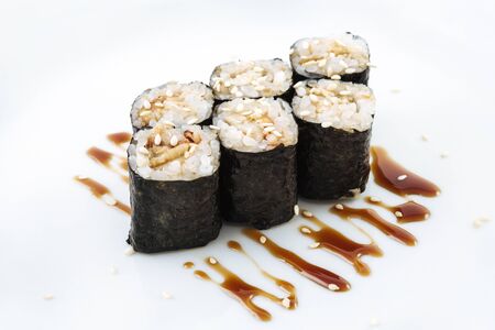 Fresh japanese sushi rolls on a white backgroundの写真素材