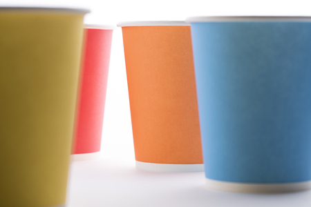 Four colorful paper cups on white background.の写真素材