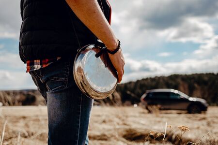 man with a flask of water in his hands is going to leaveの写真素材