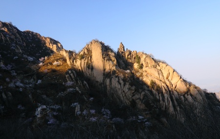 Sun shines on the top of the hillの写真素材