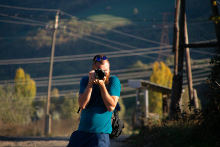 Tourist takes photos in the countryside