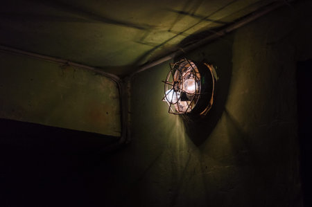 Old lantern illuminates the little dark bombshelter
