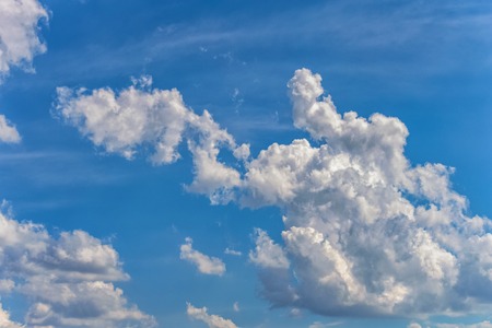 background of a blue sky with a white cloudsの写真素材