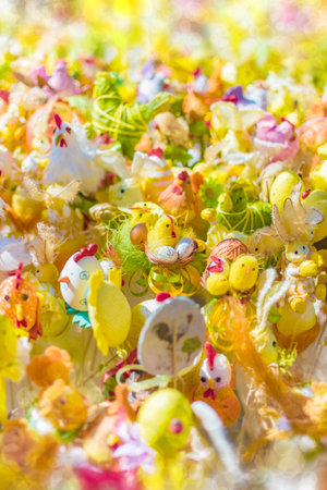 Blurred Easter background with bokeh effect. Chickens, eggs, bunnies and other Easter decorations.