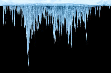 Icicles on an black background, isolated objectの写真素材
