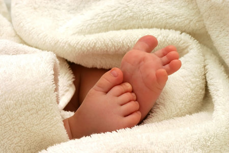 baby feet in towel