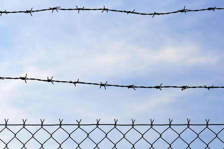 wired fence with barbed wire