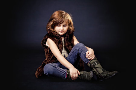 thinking girl sitting on the floorの写真素材