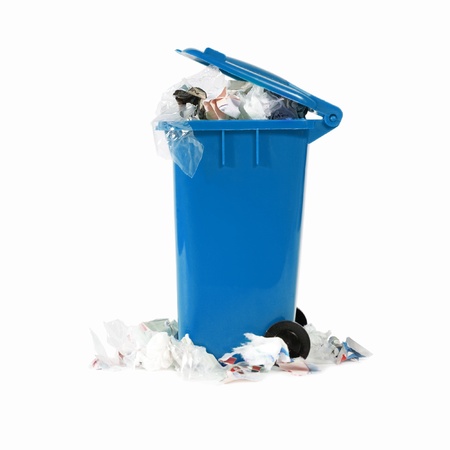 overflowing blue garbage binの写真素材