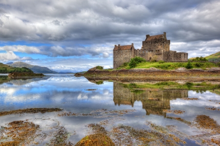 Eilean Donan castle on a cloudy day, Highlands, Scotland, UK Eilean Donan castle on a cloudy day, Highlands, Scotland, UK