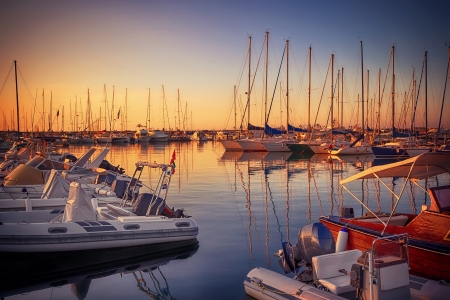 Marina with docked yachts at sunset in Giulianova, Italyの写真素材