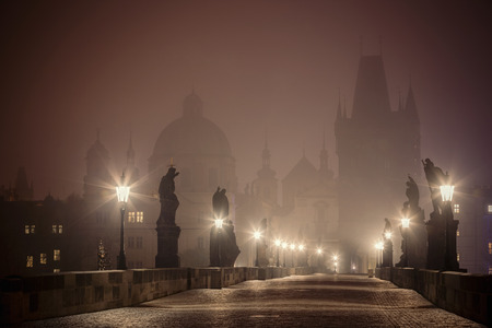 foggy Charles Bridge before dawn, Prague, Czech Republicの写真素材