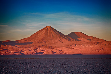 sunset over volcanoes Licancabur and Juriques, Atacama desert, Chileの写真素材