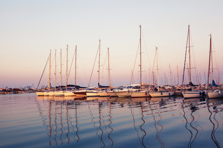 Marina with docked yachts at sunset in Giulianova, Italyの写真素材