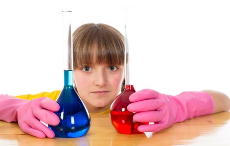 happy little girl wearing pink gloves with flasks for chemistry isolated on a white backgroundの写真素材