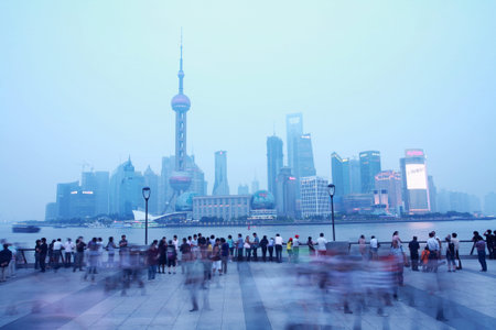 SHANGHAI - JUNE 12  More people come from all of world at Haungpu river side waiting for night scene of Pudong on June 12, 2010 in Shanghai, CN  のeditorial素材