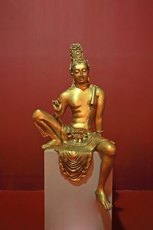 A  sculpture of a Buddha bright yellow color of gold, Sri Lanka のeditorial素材