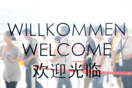 welcome on door with people passのeditorial素材