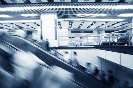Moving up escalator in morden trade centerのeditorial素材