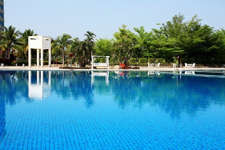 swimming pool in china hotel with palm trees. china,Sanyaのeditorial素材