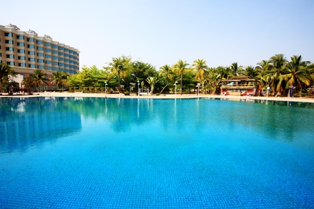 swimming pool in china hotel with palm trees. china,Sanyaのeditorial素材