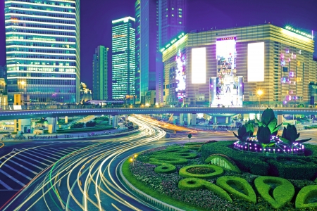 the light trails on the modern building background in shanghai chinaのeditorial素材
