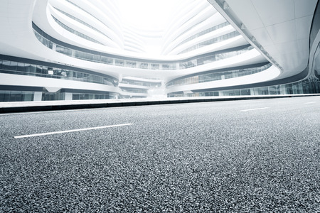 Asphalt road and modern office buildingのeditorial素材