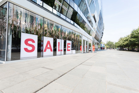 sale sign in shopping mall showcase and empty square.のeditorial素材