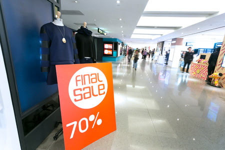 sale poster board at fashion clothes shopfrontのeditorial素材