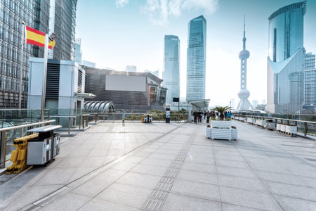 Empty footpath with modern skyline and buildings.