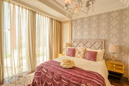 luxury hotel bedroom with upscale furniture and modern style decorationのeditorial素材