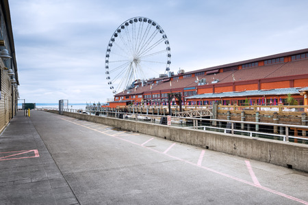 skyline and architecture near Ferris wheel by the seaのeditorial素材