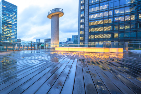 wood wet floor front modern office building at twilight in tokyoのeditorial素材