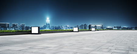 modern office buildings in hangzhou west lake square at night on view from empty streetのeditorial素材