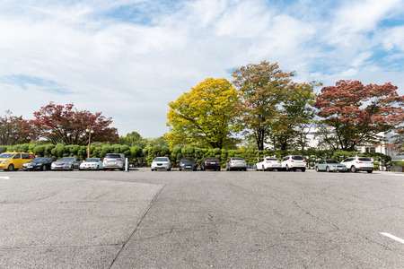 empty brick floor near park in cloud skyのeditorial素材