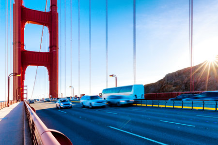 busy traffic on landmark gold gate bridge in blue skyのeditorial素材