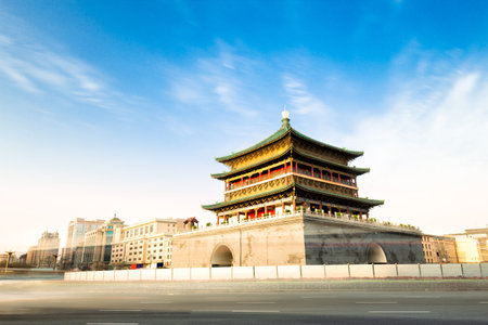 famous ancient Bell Tower in Xi'an in cloud sky from busy roadのeditorial素材