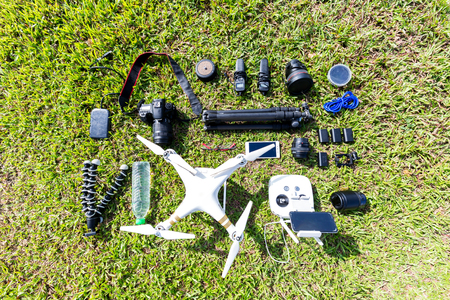 drone and other photography instruments on green grassのeditorial素材