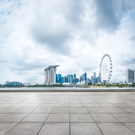 landmark buildings near marina bay in singapore from empty brick floorのeditorial素材