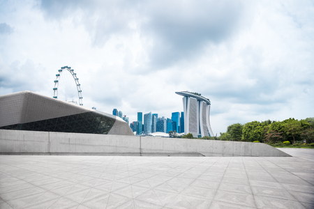 landmark buildings near marina bay in singapore from empty brick floorのeditorial素材