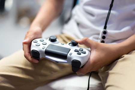 little chinese boy plays game with VR in S&T exhibitionのeditorial素材