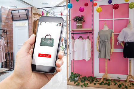 smart phone with shopping online app in modern shopping mallのeditorial素材