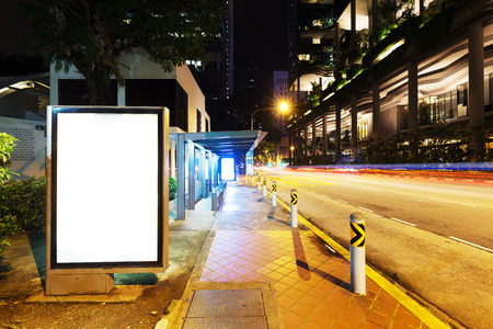 blank billboard on street in midtown of singapore at nightのeditorial素材